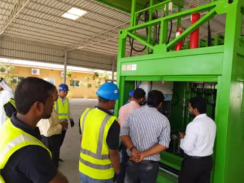 Engineers and site team inspecting the dispensing cabinet of the Emarat unit