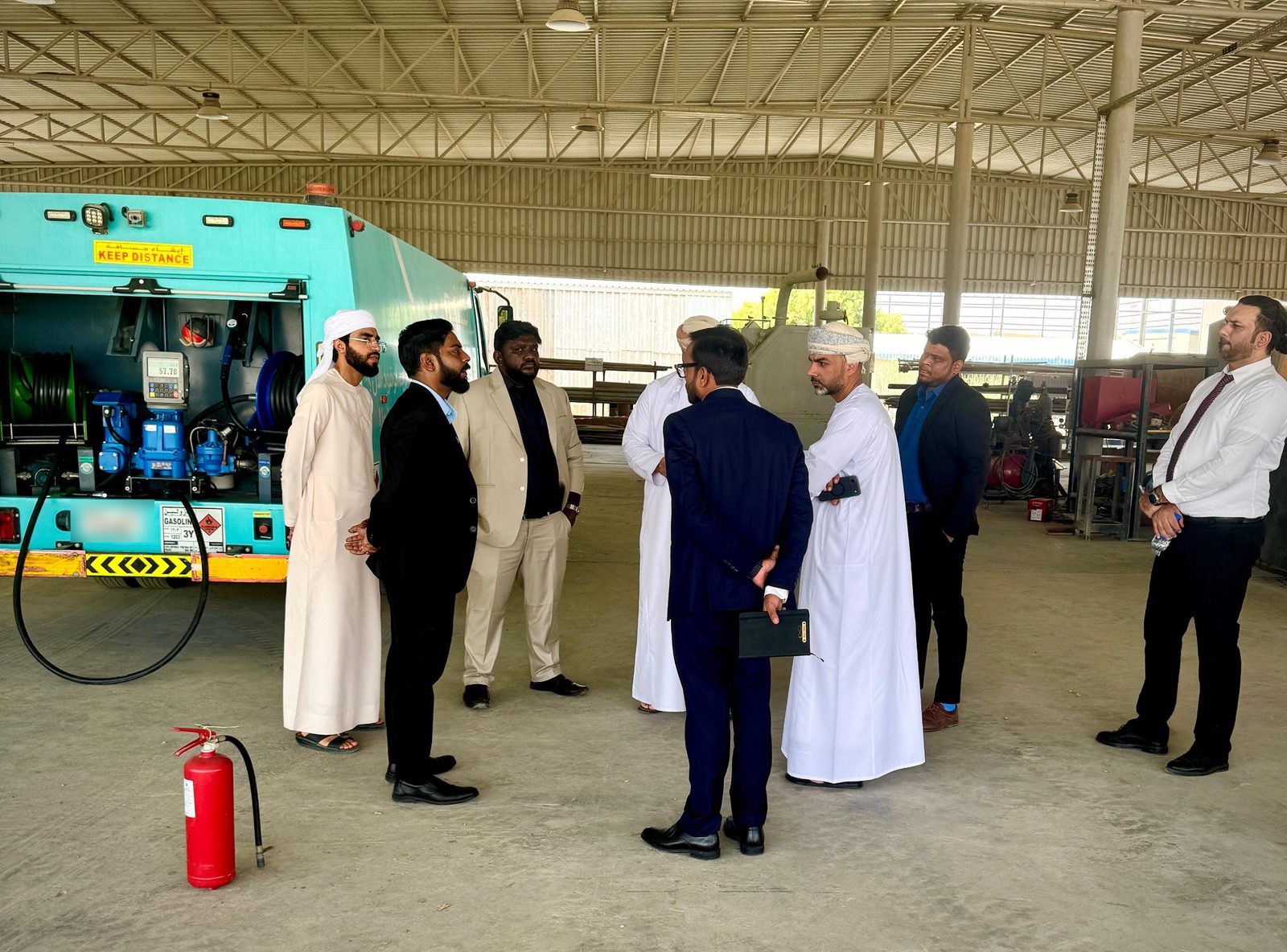 Visiting client delegation in discussion with the project team in the workshop