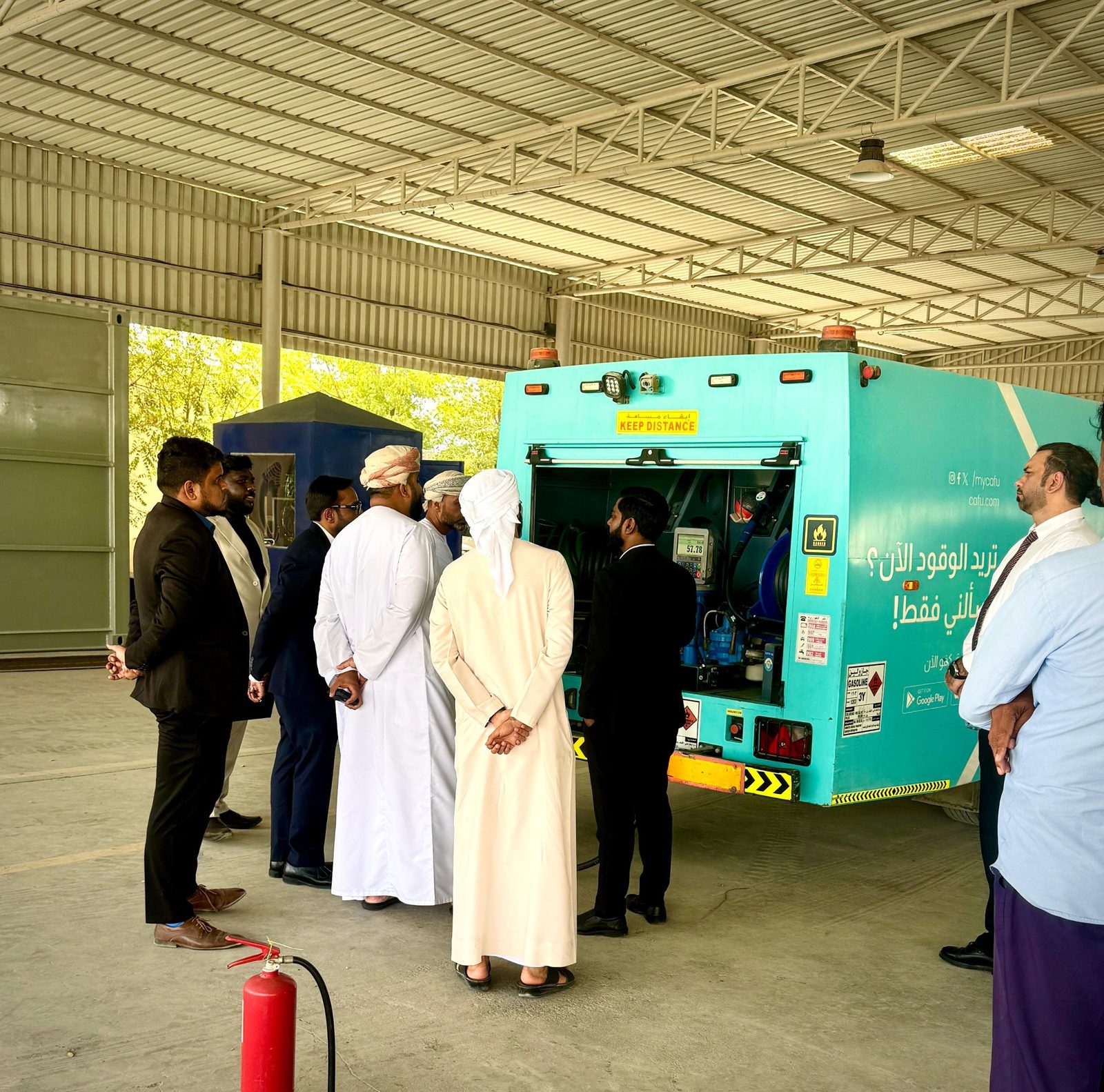 Visitors viewing the dispensing cabinet of a third-party mobile fuelling truck
