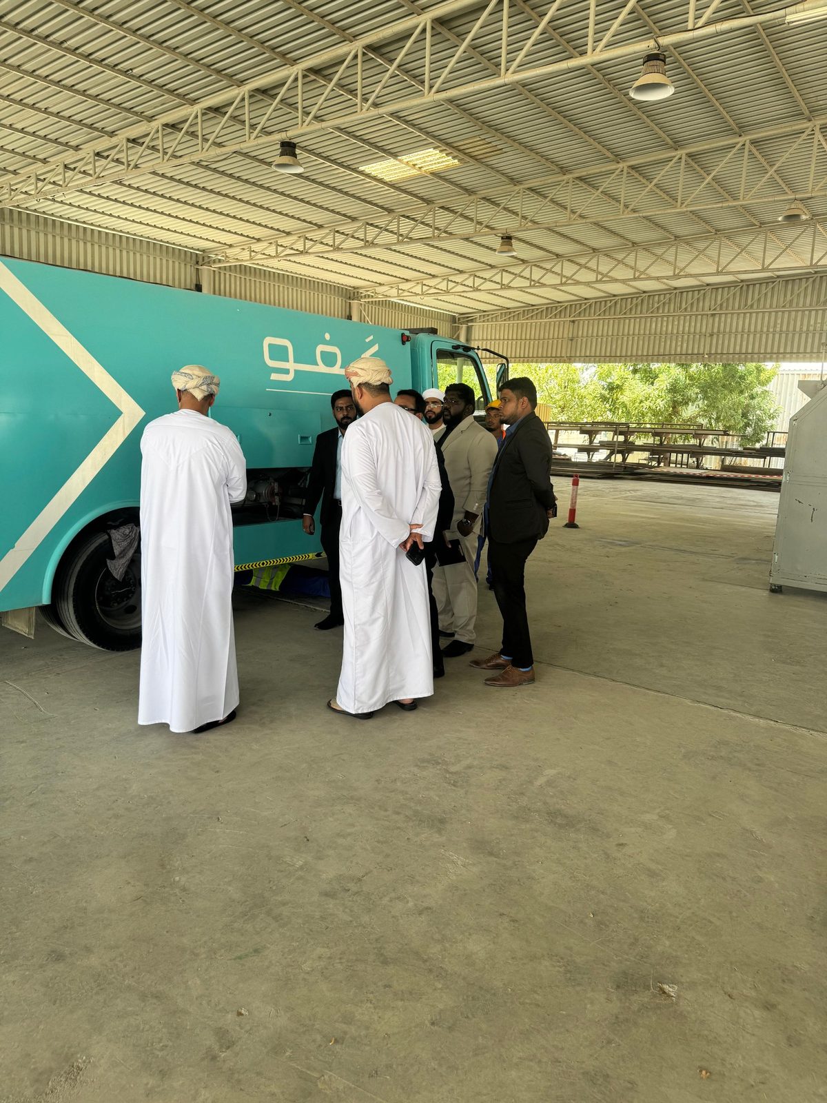 Visitors walking round the side of a third-party mobile fuelling truck